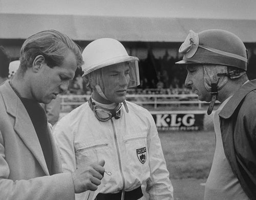 Unknown Photographer - Peter Collins, Stirling Moss and Juan Manuel Fangio on the Silverstone grid, British Grand Prix, July 14, 1956