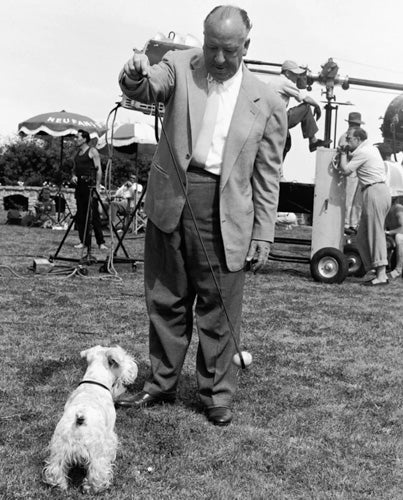 Edward Quinn - Alfred Hitchcock with his dog, Cannes, 1954